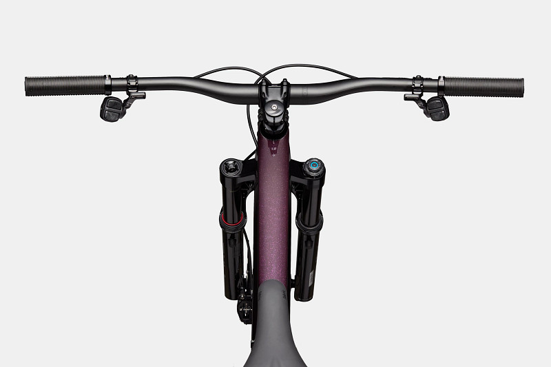 Top view of a mountain bike's handlebars and front suspension, featuring black grips and a purple frame.