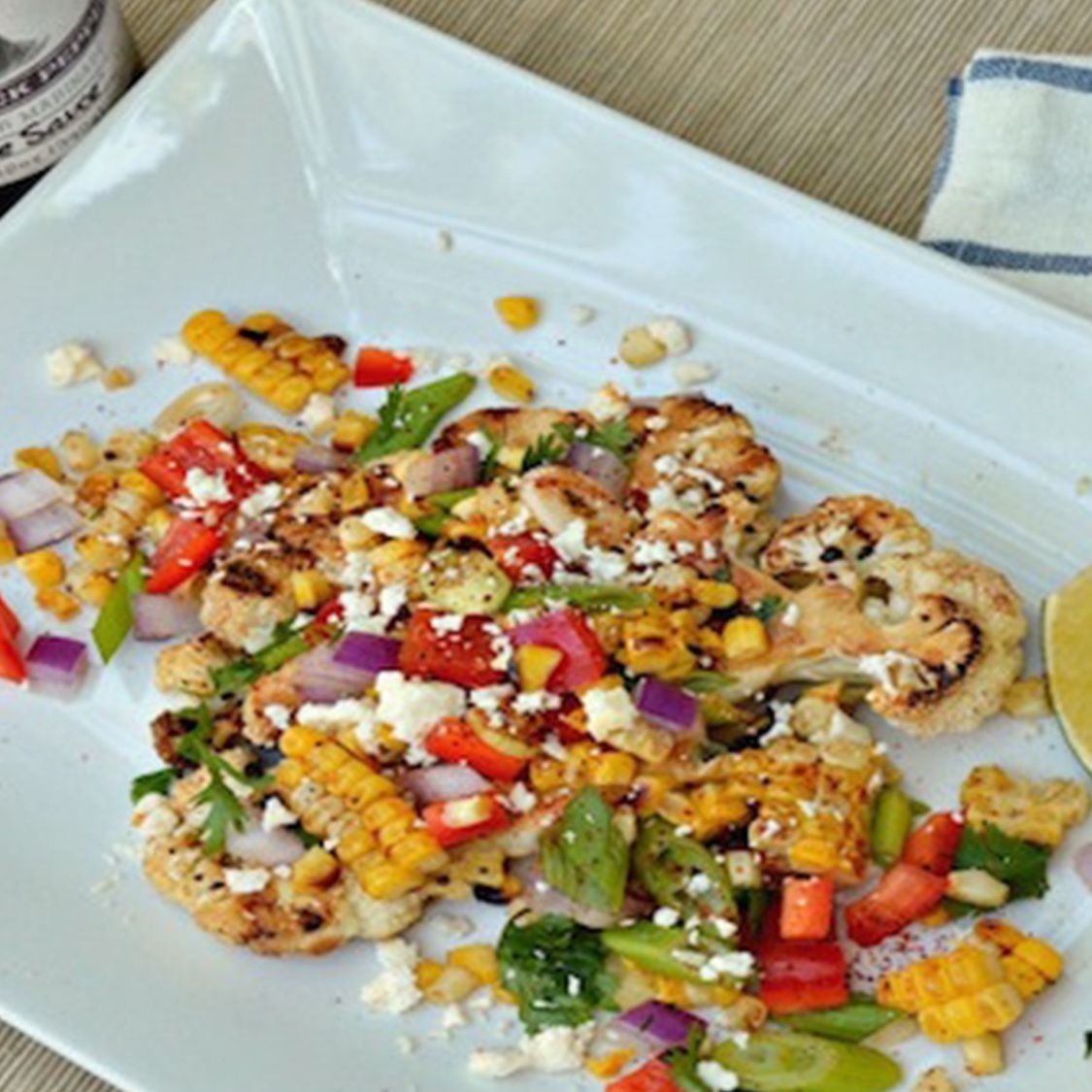 Grilled Sweet Black Pepper Cauliflower Steaks with Charred Corn Salad