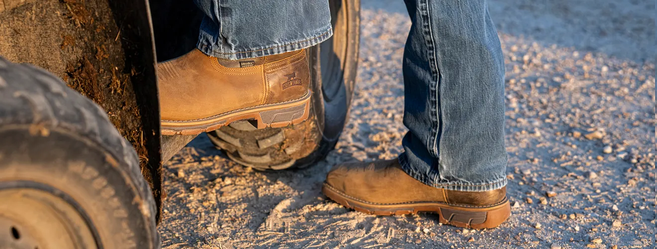 Close up of Irish Setter pull-on boots that a person is wearing stepping into a vehicle