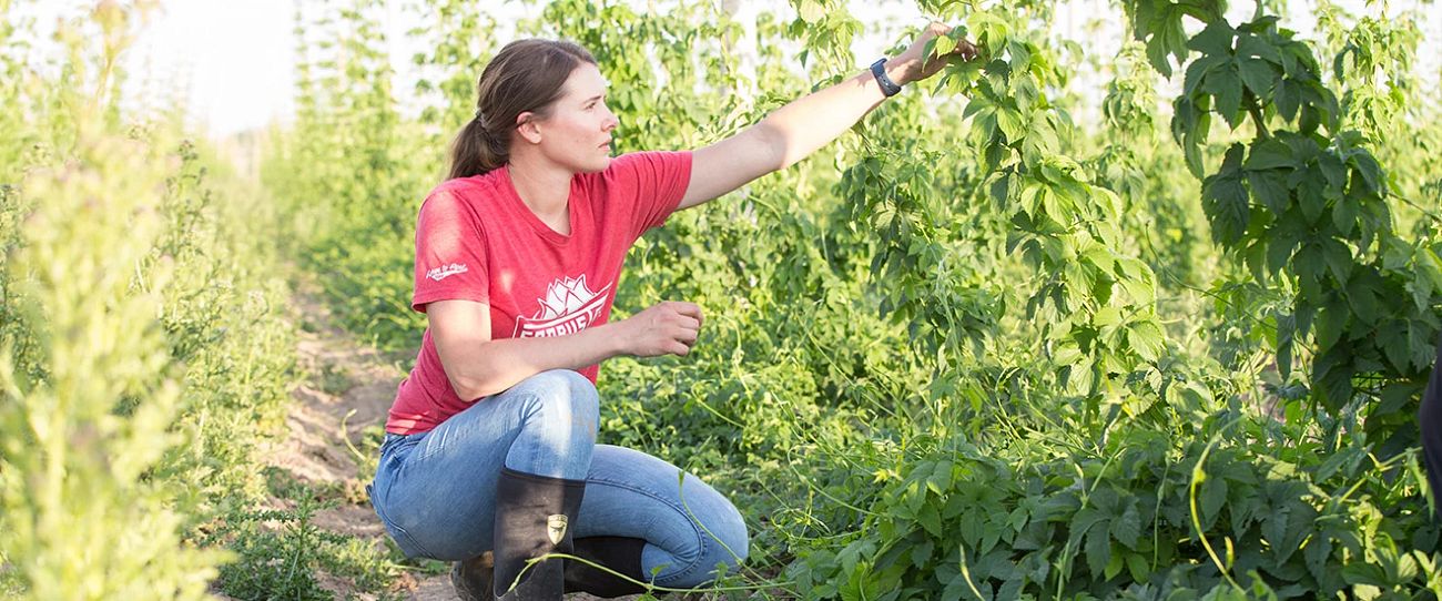 Alexa Weathers kneeling in the field