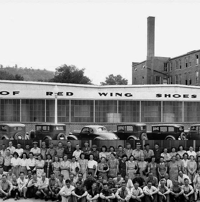 Historical photo of the Red Wing Shoes building and a large group of people