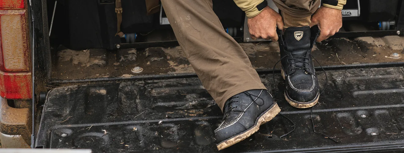 Closeup of a man pulling on his boots 
