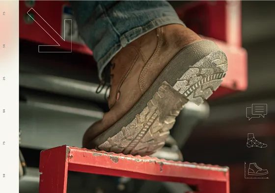 Close up of the bottom of a boot going up a step