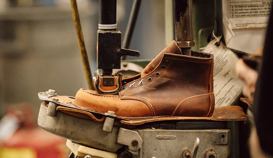 Close up of a shoe on a shoe-making machine