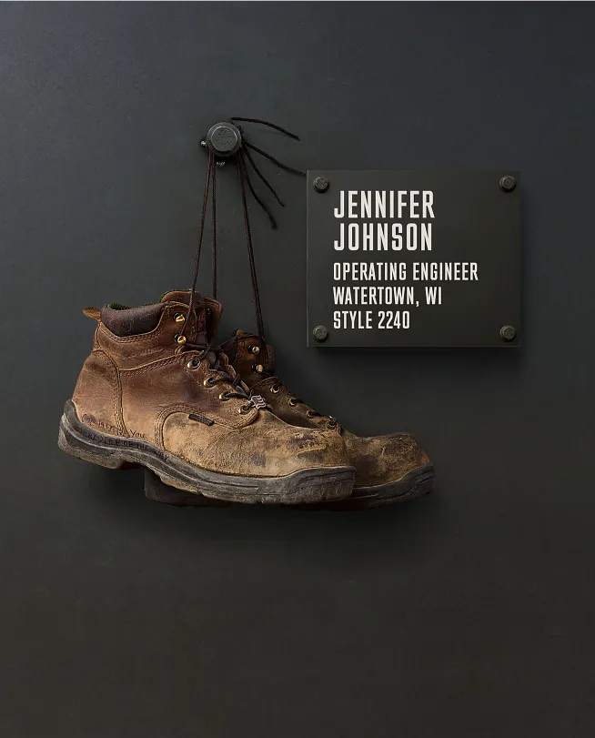 Jennifer Johnson's boots hanging on the Wall of Honor by a plaque with information