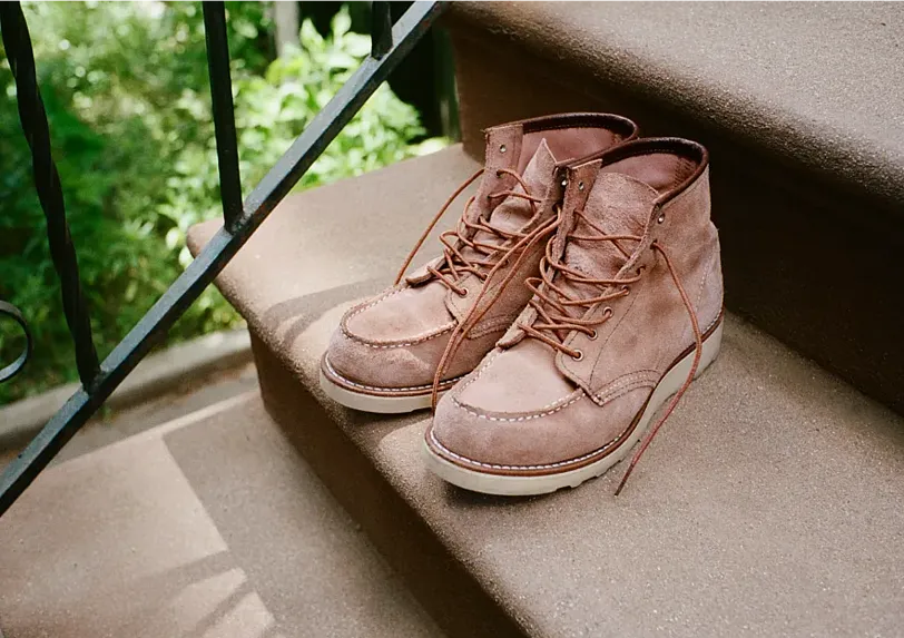 A pair of Red Wing boots on stairs