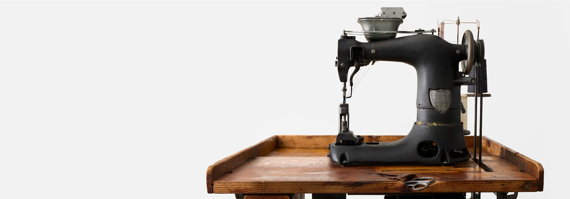 An old Puritan sewing machine on a table