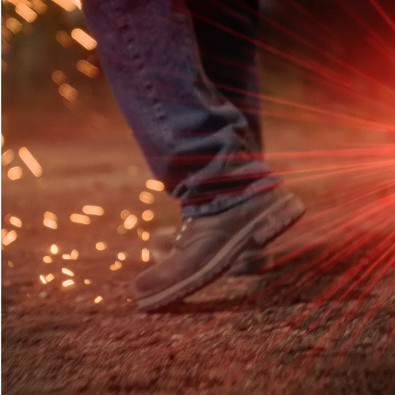 Close up of boots and sparks