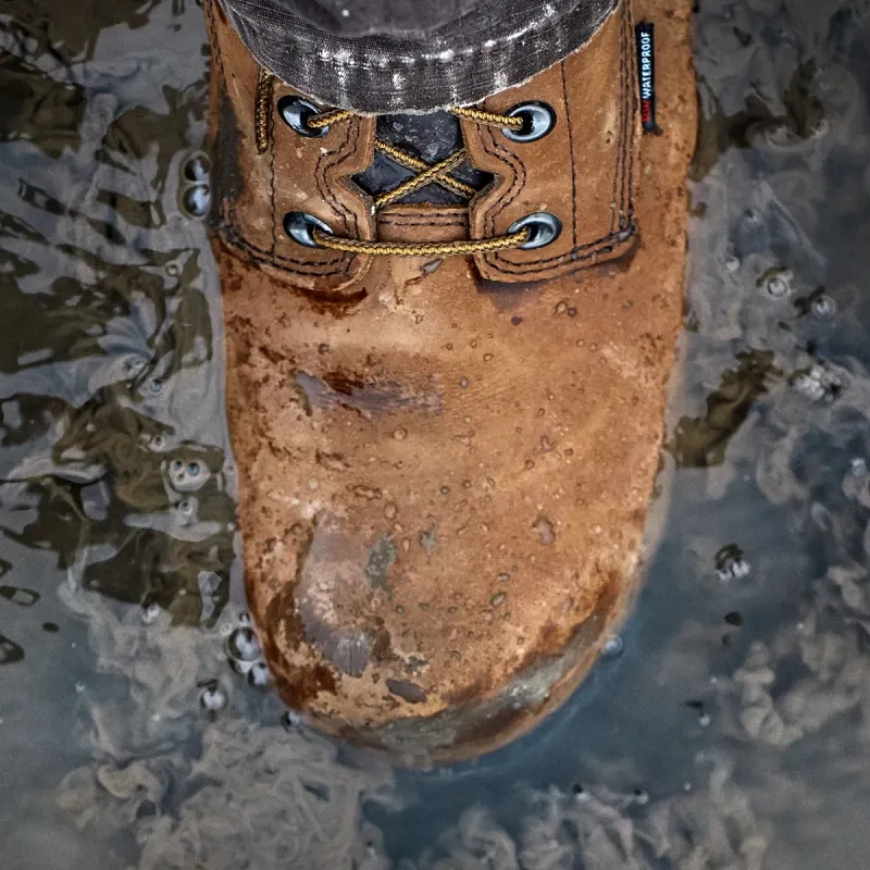 Close up of Red Wing King Toe boot stepping in water