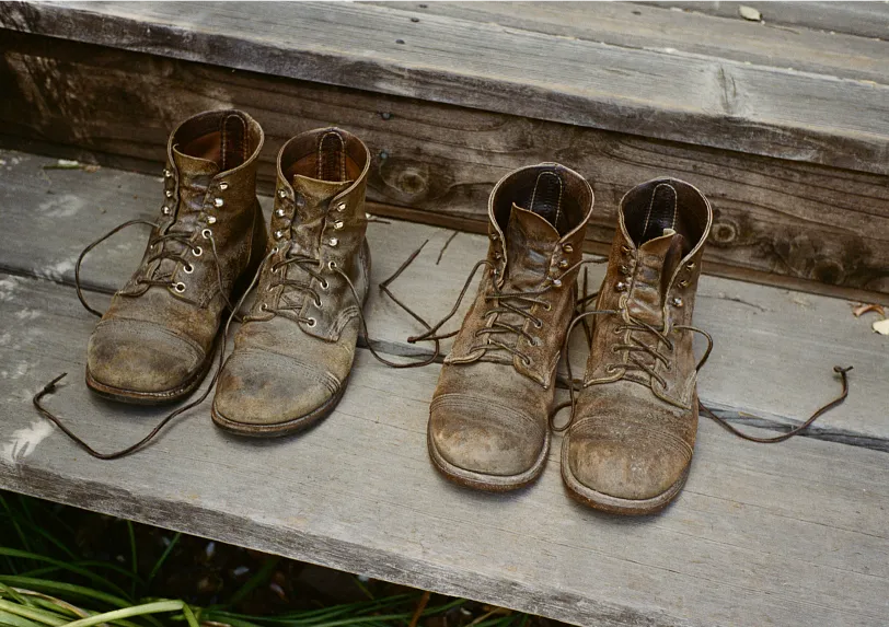 Two pairs of Red Wing Boots on some stairs
