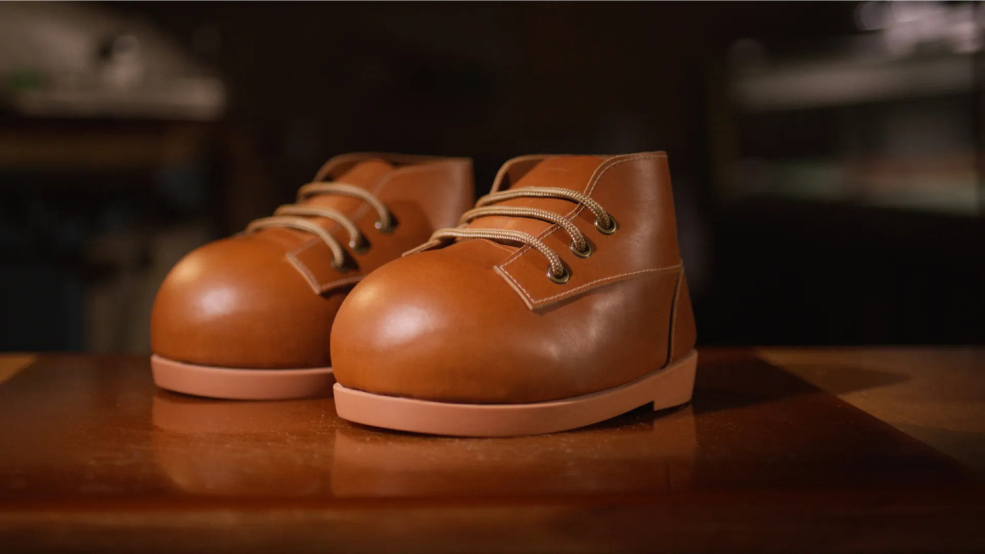 Mario's boots on a table with a black background