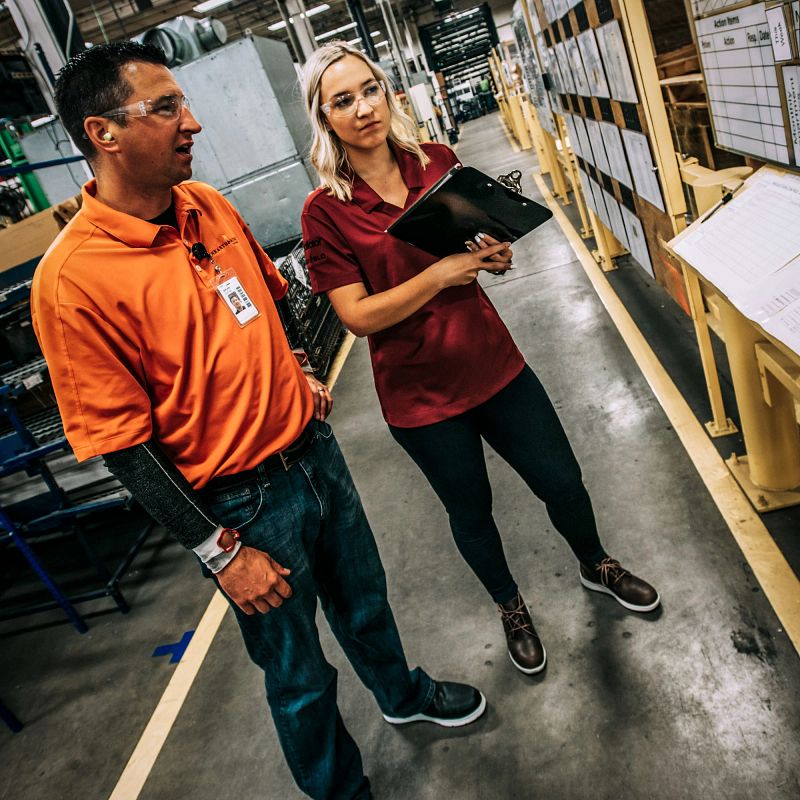 Two warehouse workers wearing Cross Lite Boots