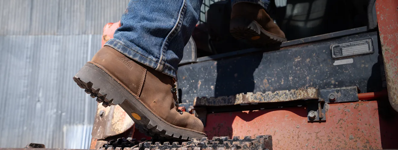 Close up of Shorewood boots on a person climbing steps
