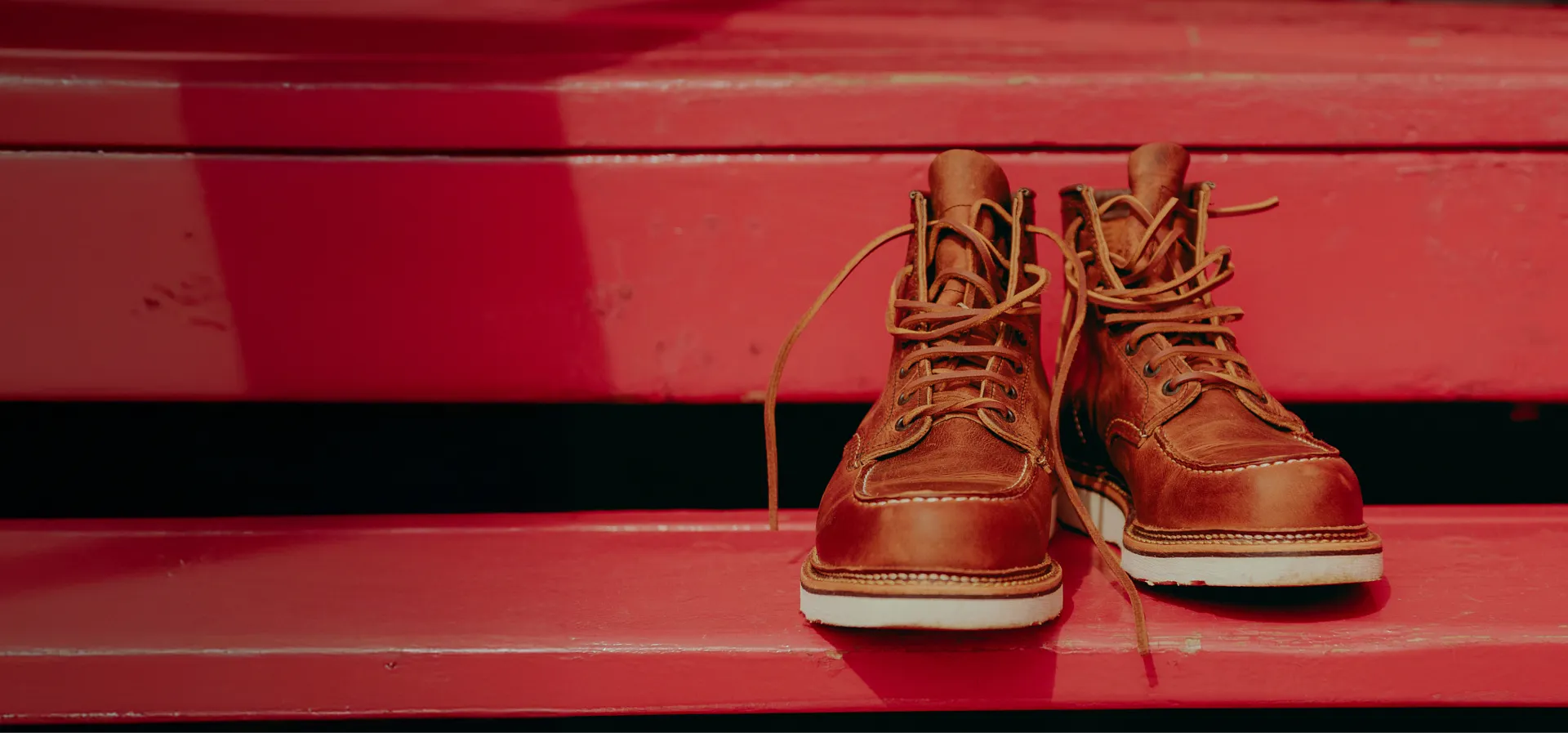 A pair of boots on red steps