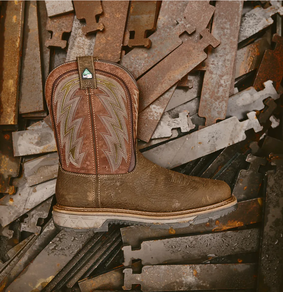 A boot laying on a pile of metal