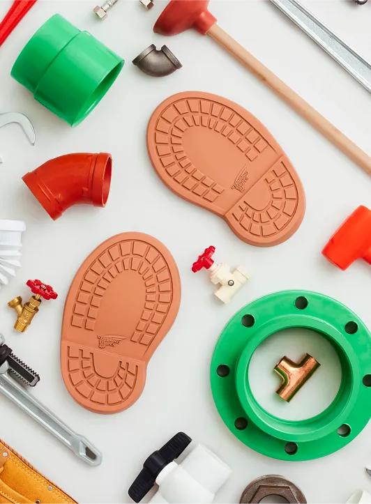 Overhead view of Mario's plumbing tools and boot soles