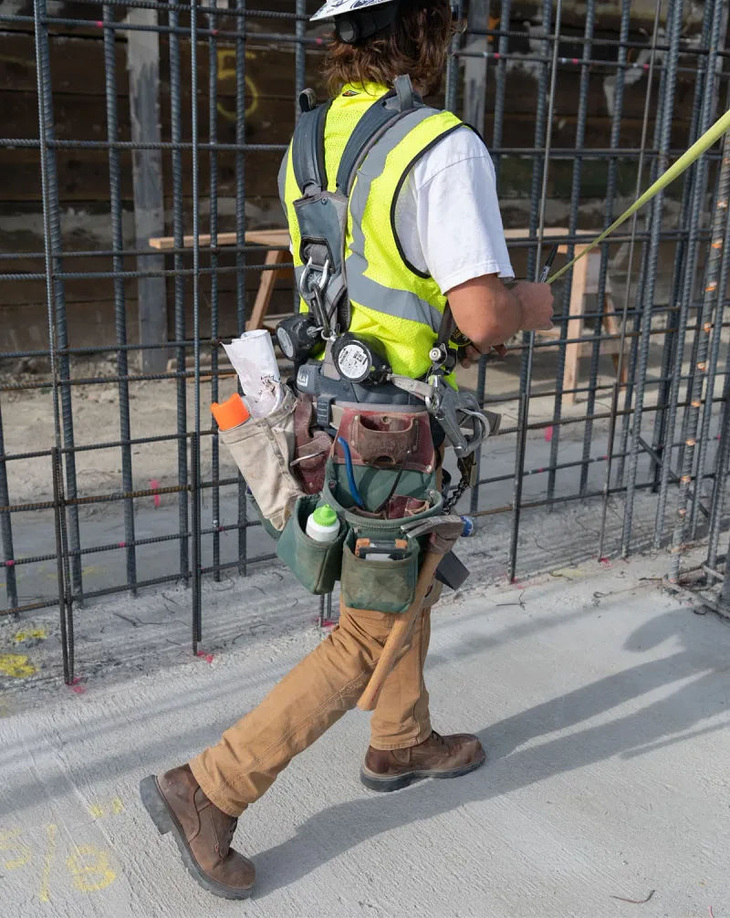 Construction worker walking wearing Dynaforce boots