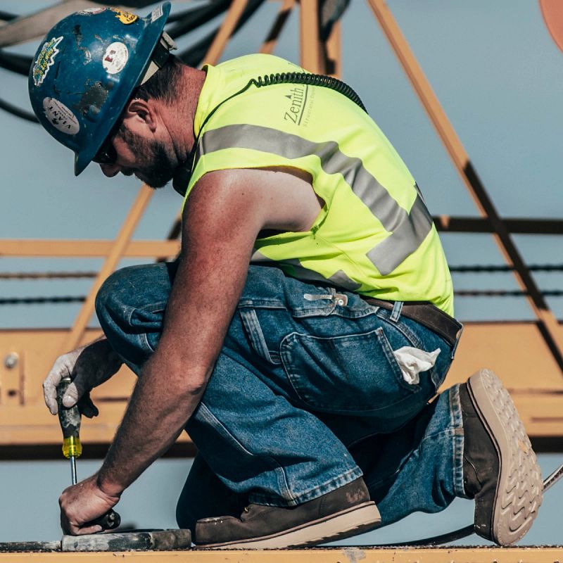 Worker at a contruction site wearing Traction Tred Lite Boots