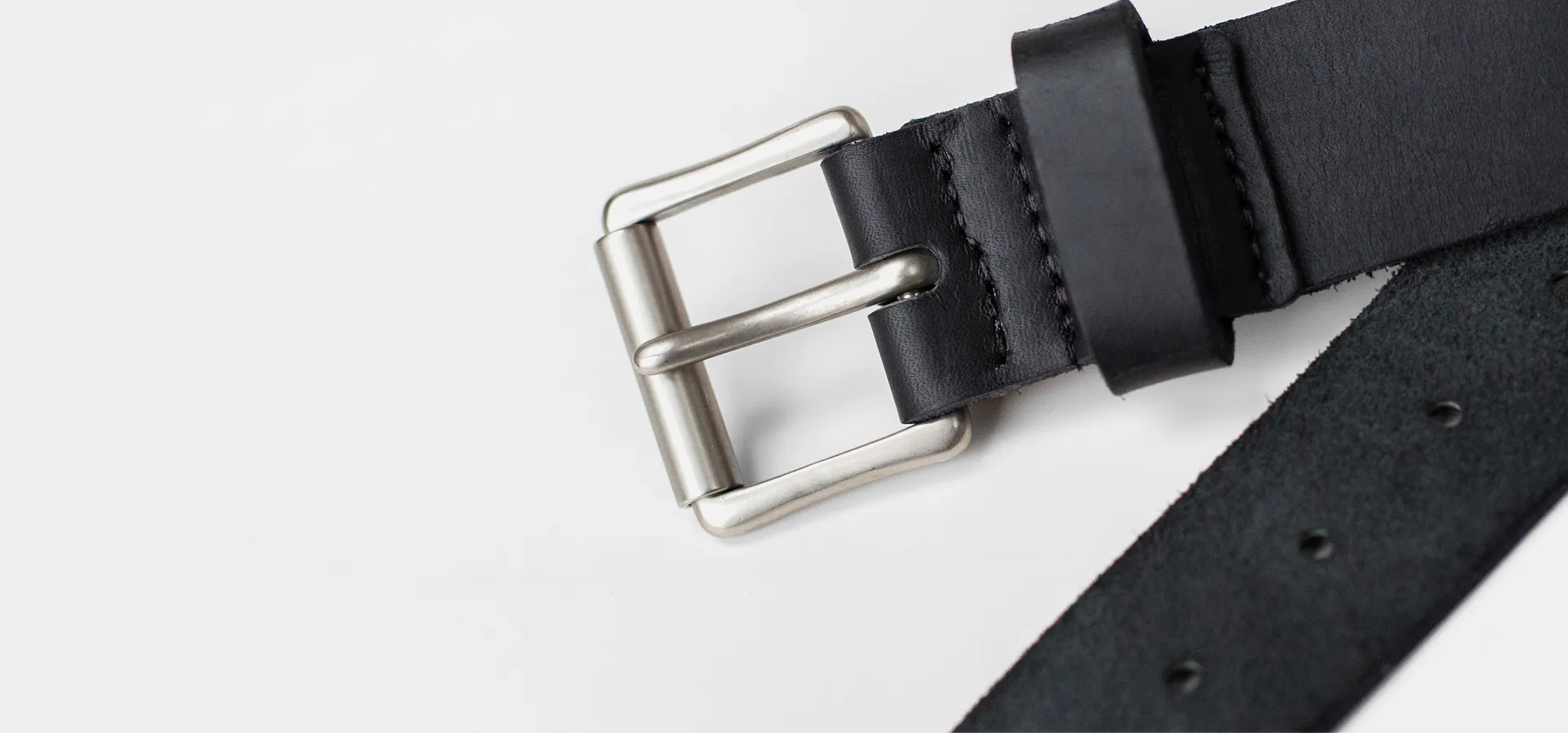 Close up of a black belt on a white background