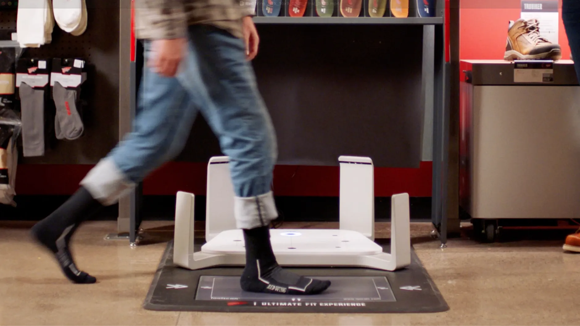 Close up of a person's feet walking over the Ultimate Fit Experience tester