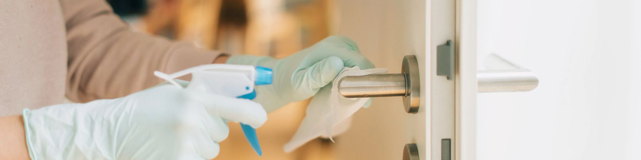 cleaning-gloves-sanitizing-door-handles-coronavirus-covid-19