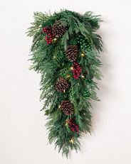 artificial greenery arrangement with decorations