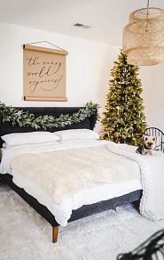 pre-lit Christmas tree in the bedroom