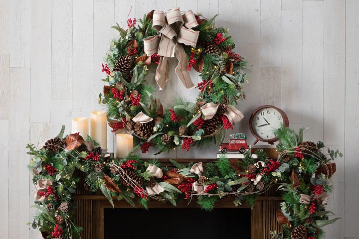 realistic artificial Christmas tree with lights and red and gold decorations