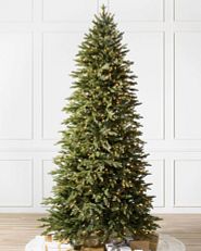 A narrow Balsam Hill Silverado Slim artificial Christmas tree