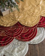 Christmas tree skirts in gold, red, and white