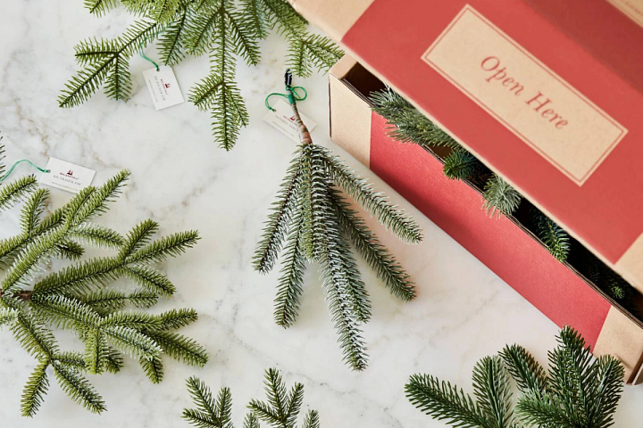 close-up photo of artificial Christmas tree branch clippings on a table