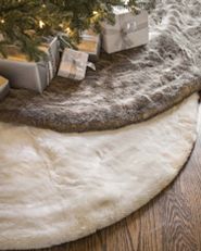 pair of faux fur Christmas tree skirts in ivory and stone colors