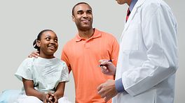 teen and parent at doctor consultation