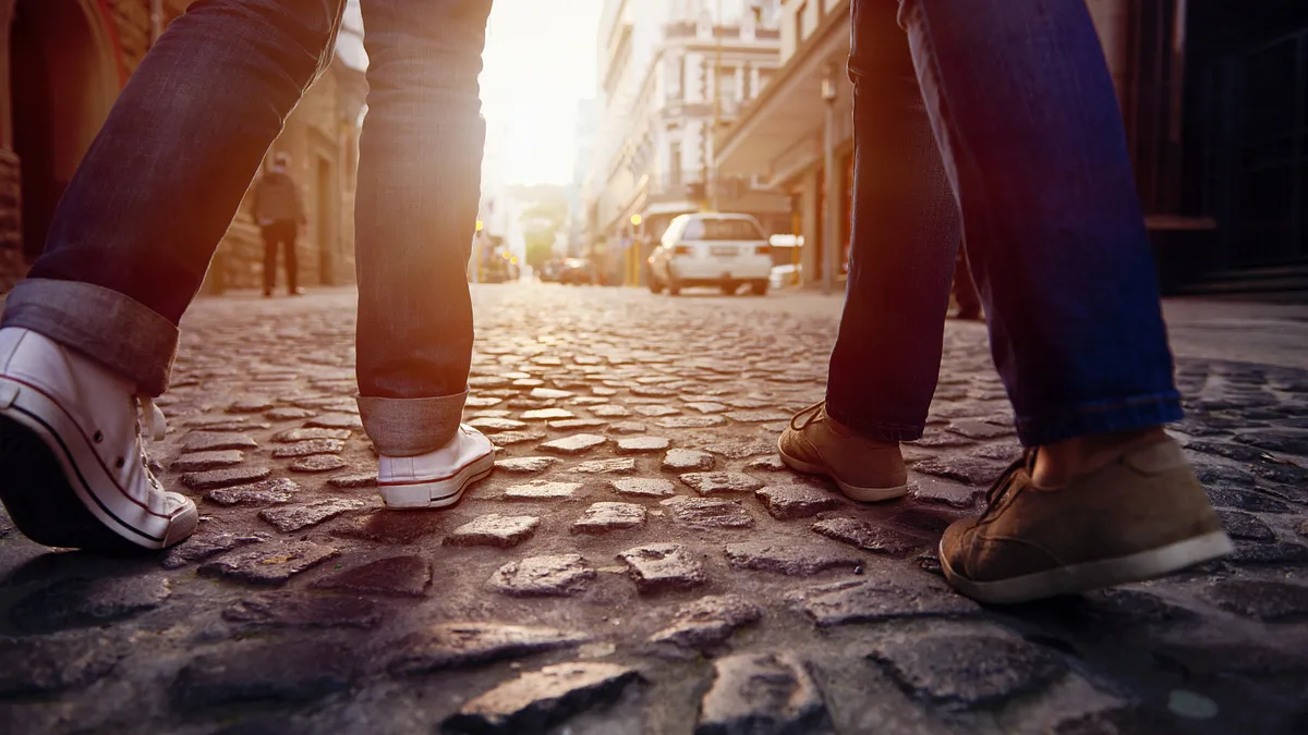 https://embed.widencdn.net/img/veritas/8nea6v9u2b/1200x675px/couple-walking-on-stone-street.webp