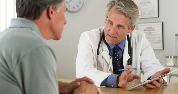 Patient consults with doctor about treatment plan.