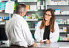 Image of a person speaking to a pharmacist