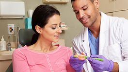 Patient and dentist have a consultation.