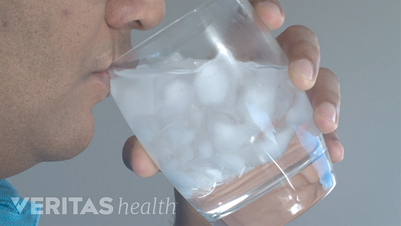 closeup image of man drinking ice water