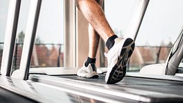 Person's feet walking on the treadmill