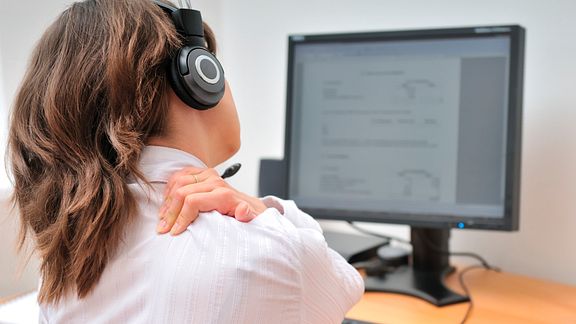 Call center employee with shoulder pain