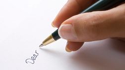 Close up holding a pen
