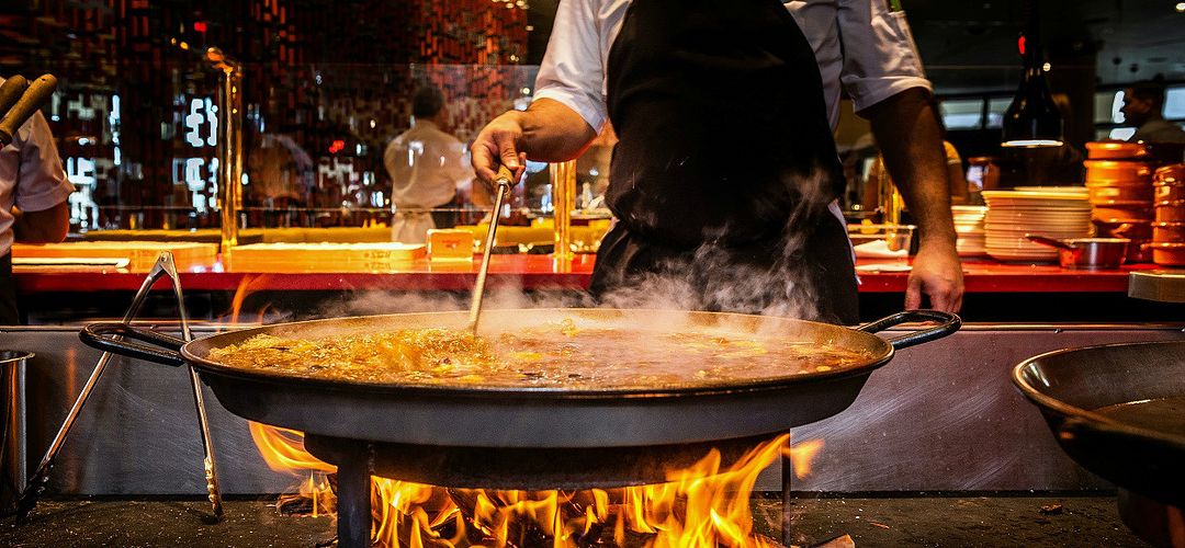 Magical Dining at JALEO A chef prepares paella at JALEO Disney Springs during Visit Orlando's Magical Dining.