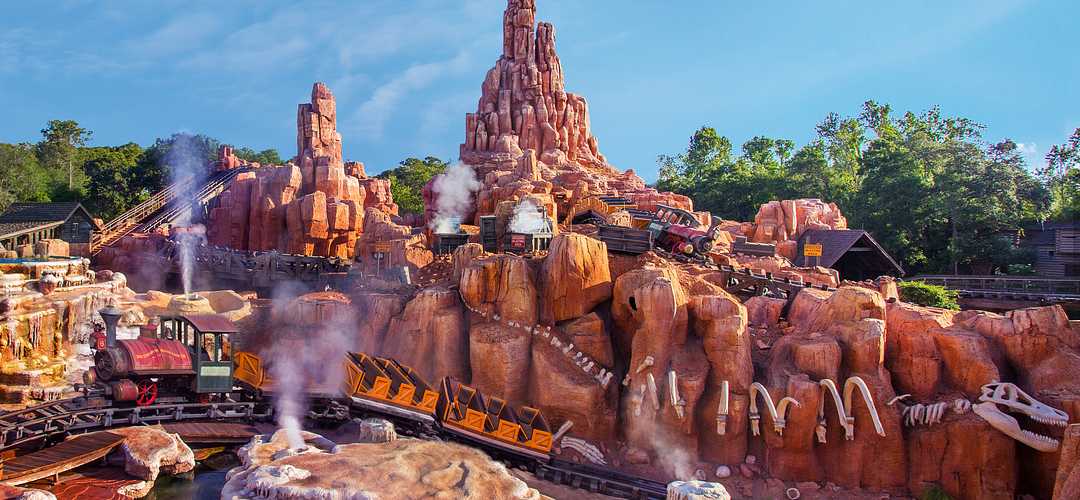 Park guests riding Big Thunder Mountain Park guests riding Big Thunder Mountain at Magic Kingdom in Walt Disney World Resort