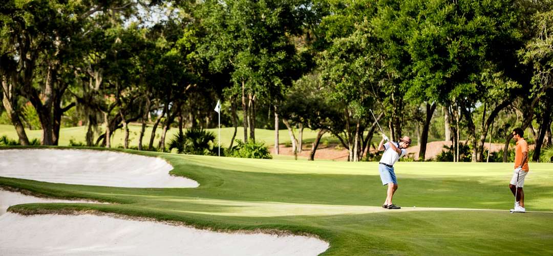 Four Seasons Schoolcation featuring Golf A golf student and instructor playing at the Four Seasons Resort Orlando at Walt Disney World® Resort
