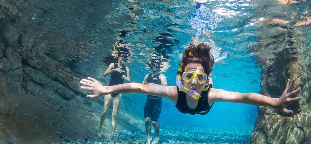 Wind-away River at Discovery Cove A woman snorkeling at Discovery Cove's Wind-Away River in Orlando.