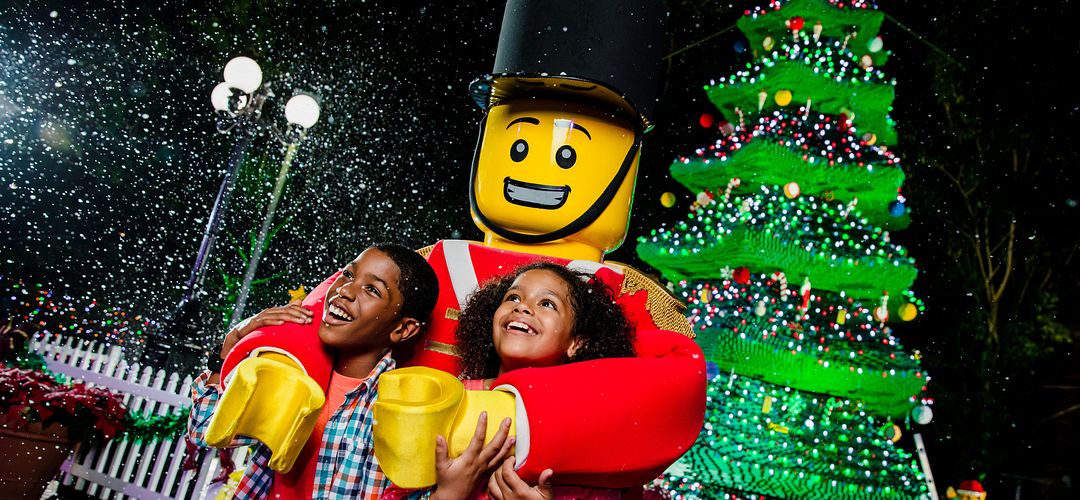 Holidays at LEGOLAND Florida Resort Children smile with a LEGO man during Holidays at LEGOLAND Florida Resort.