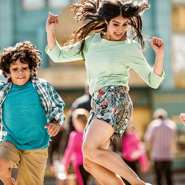 A family skipping in the street at Universal Studios Florida