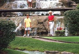 Putt your way through mountain caves, over footbridges and under waterfalls at Pirate's Cove Mini Golf