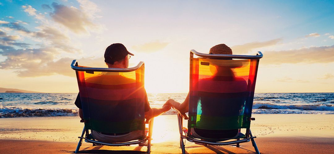 Couple at the Beach A couple viewing the sunset from their beach chairs