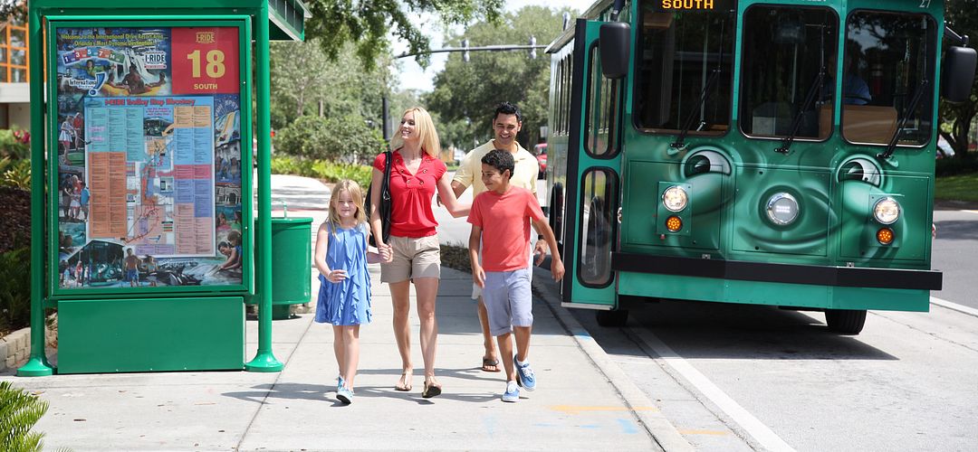 I-Ride Trolley Service I-Ride Trolley Service family waiting at a bus stop